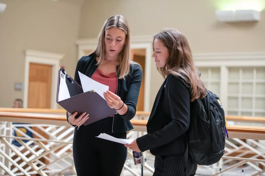 students looking over resume 